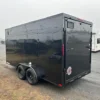 2025-HOMESTEADER-ENCLOSED-CARGO-TRAILER-RAMP-DOOR-ADDED-HEIGHT-BLACK-TRIM-1.webp Homesteader 7 x 16 V-Nose Enclosed Cargo Trailer