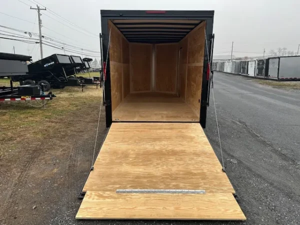 2025-HOMESTEADER-ENCLOSED-CARGO-TRAILER-RAMP-DOOR-ADDED-HEIGHT-BLACK-TRIM-5.webp Homesteader 7 x 16 V-Nose Enclosed Cargo Trailer